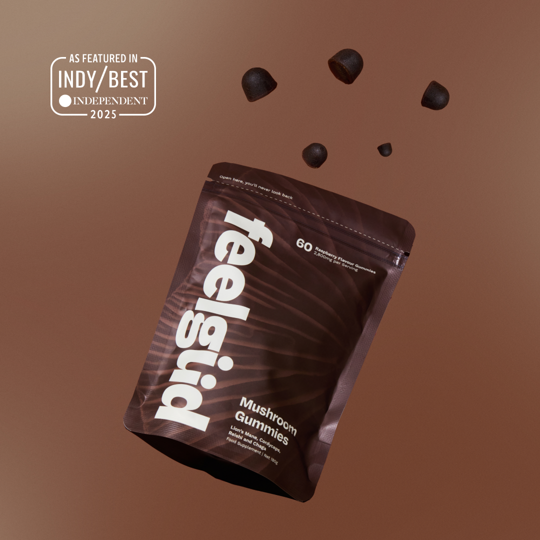 Feelgood Mushroom Gummies packaging with gummies floating above on a brown background