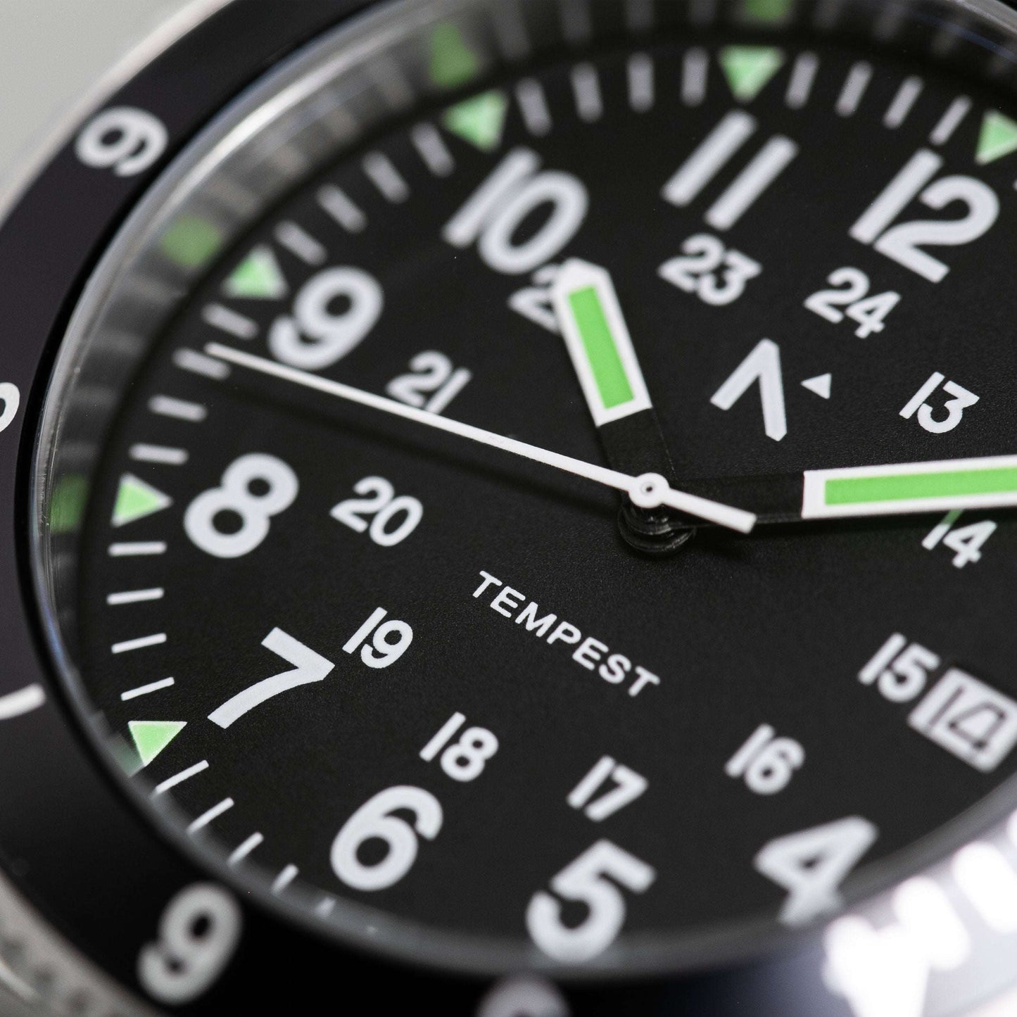 Close-up of a watch face with 'Tempest' branding on a black background