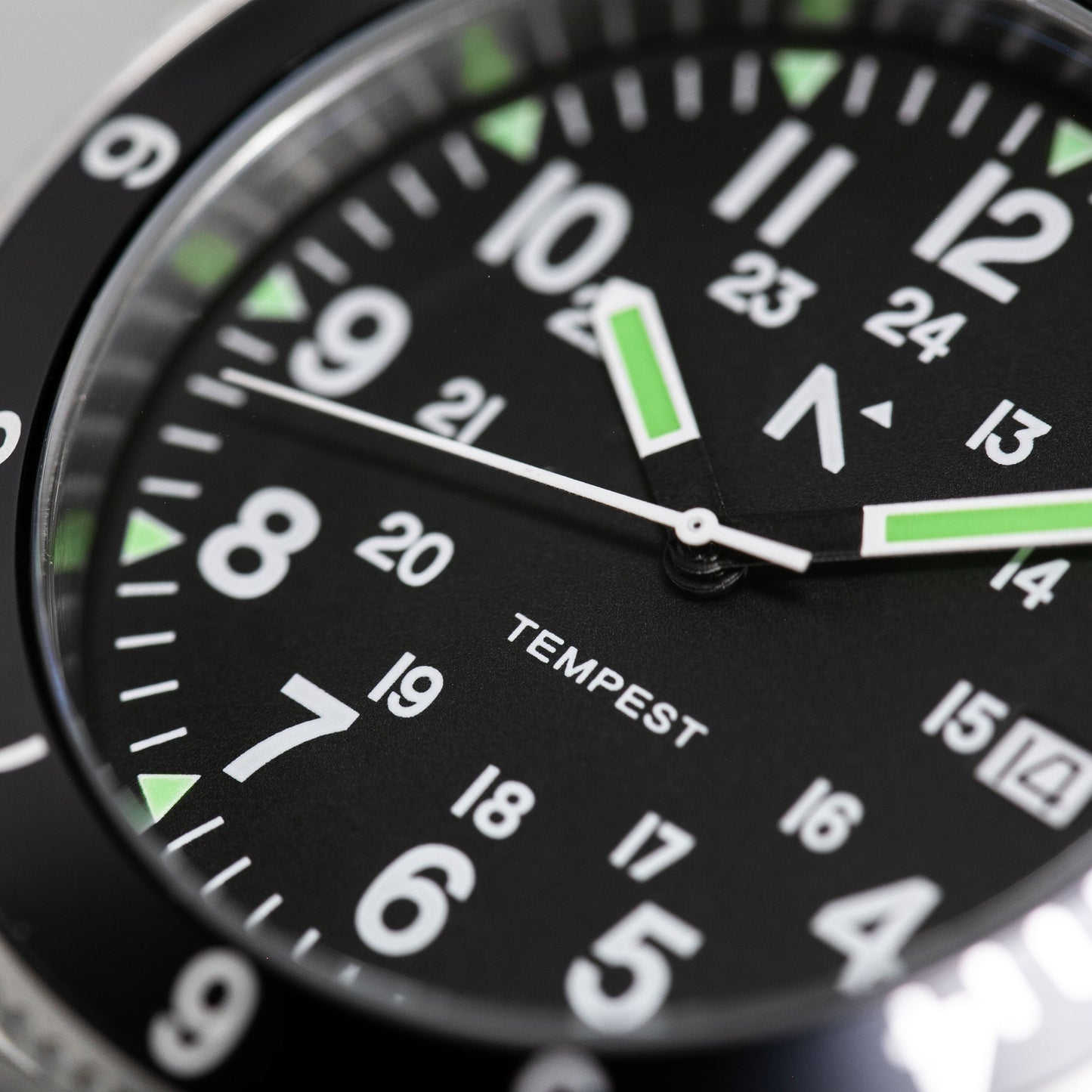 Close-up of a watch face with 'Tempest' branding on a black background