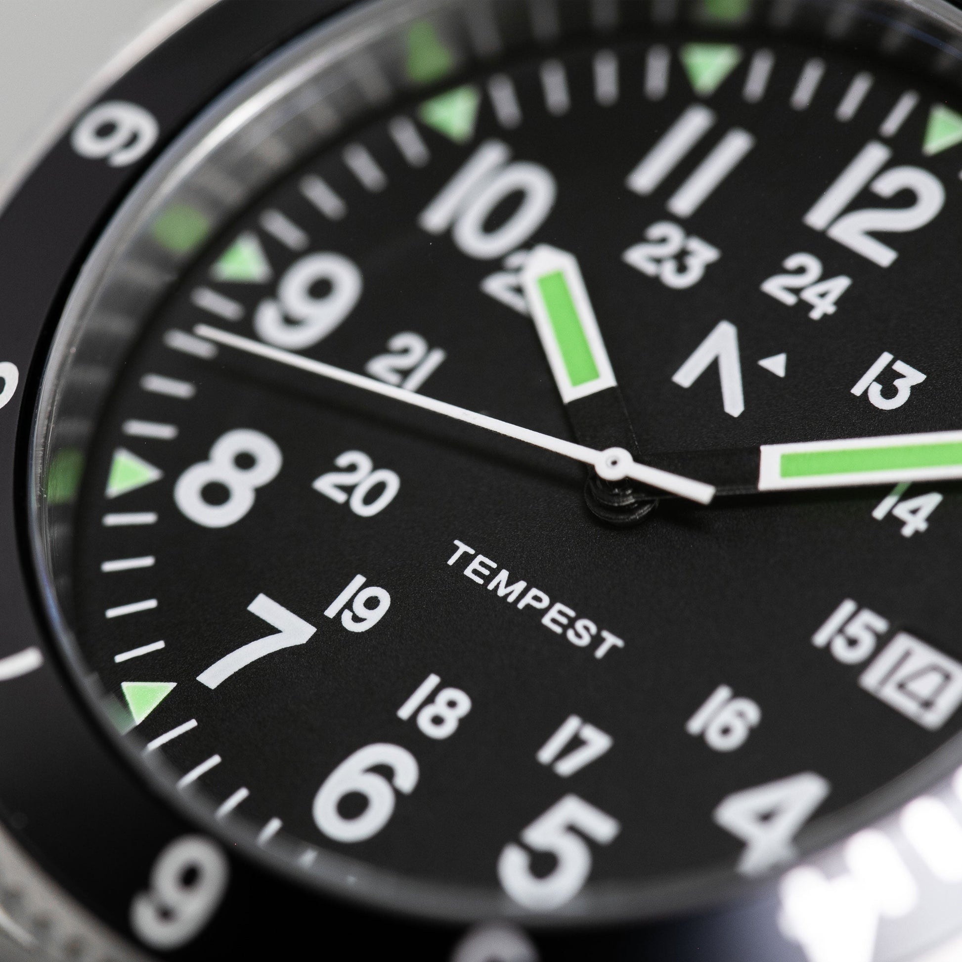 Close-up of a watch face with 'Tempest' branding on a black background