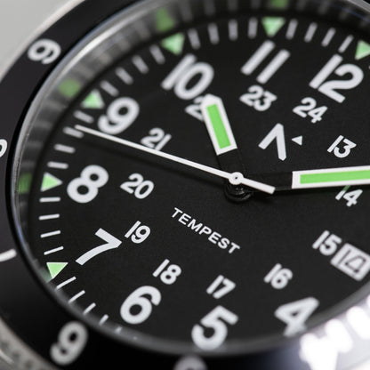 Close-up of a watch face with 'Tempest' branding on a black background