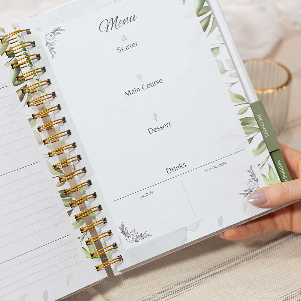 Menu planner with green pen on a light surface