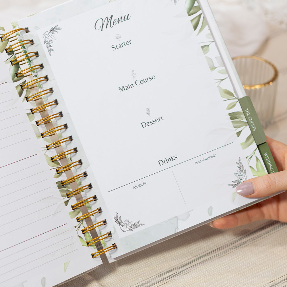Menu planner with green pen on a light surface
