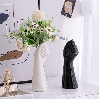 White Ceramic Hand Vase holding flowers